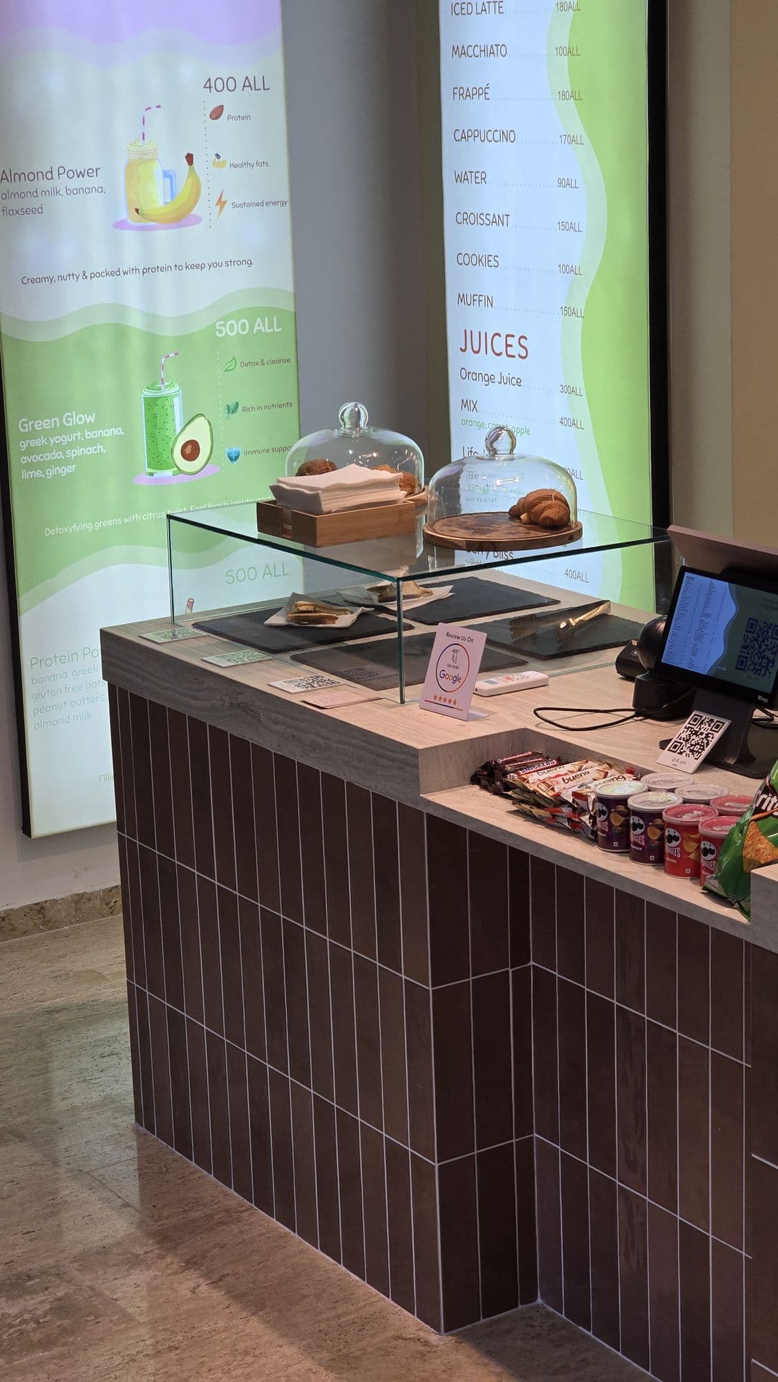 Pastry case and espresso counter at the Sip & Spin coffee bar in Golem